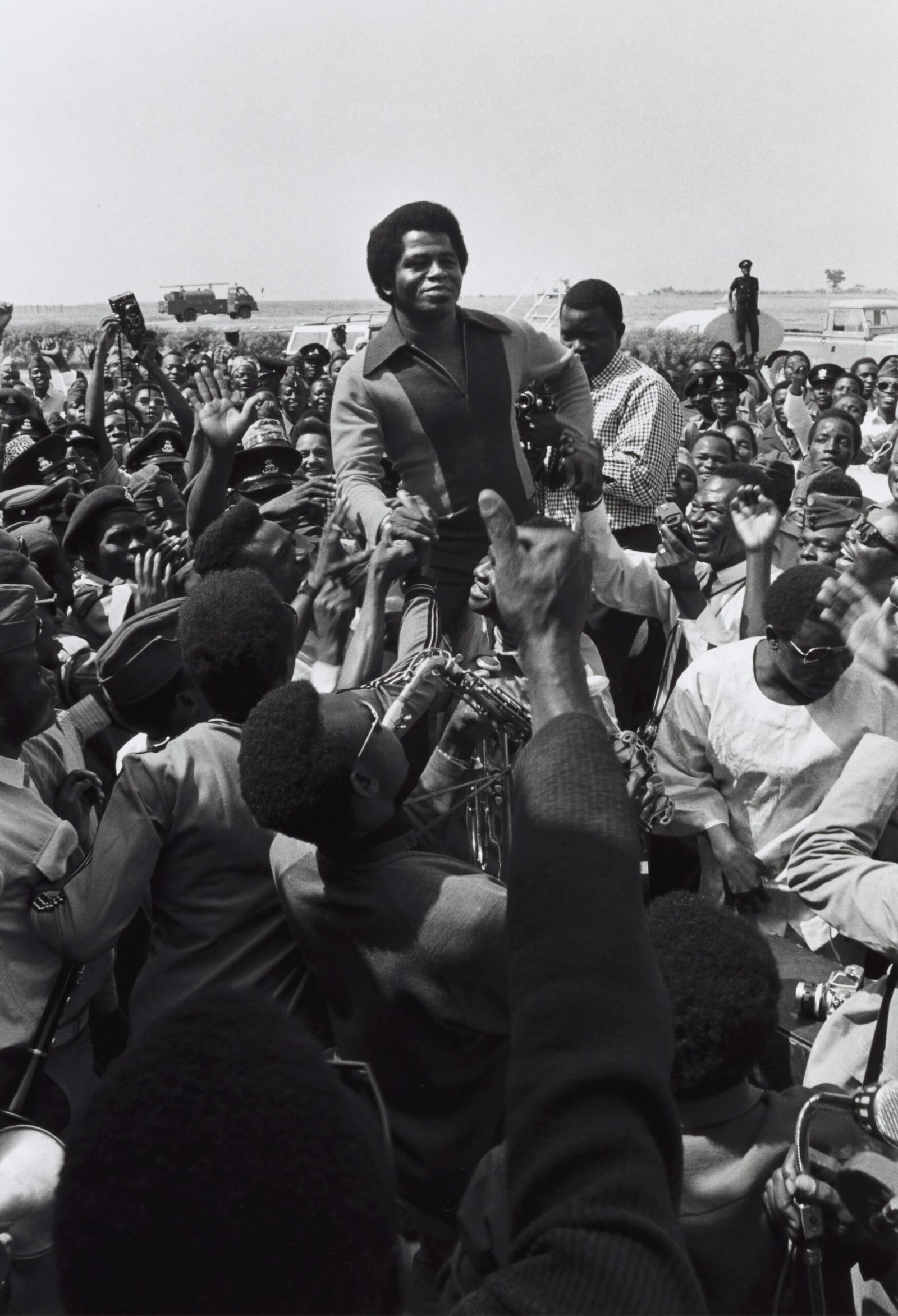 a large group of people sitting around each other